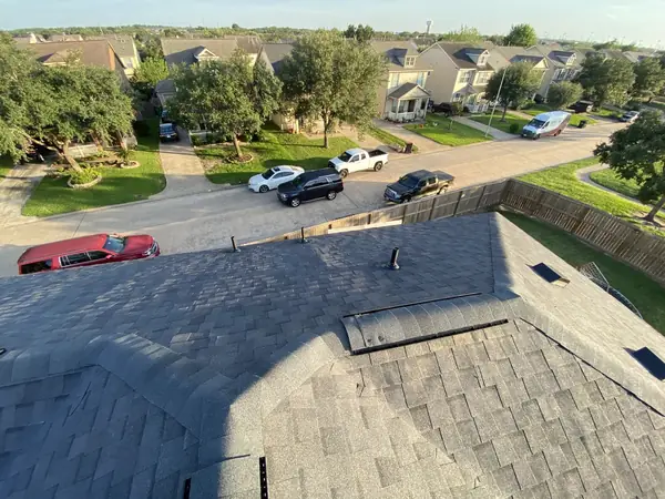 Hip roof with new ridge vent looking toward the street in north Katy