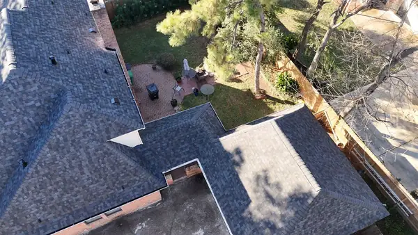 Aerial view of a roof repair area in Inwood Forest, Houston