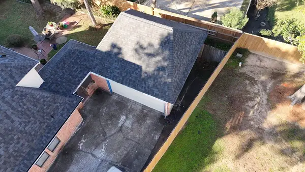 Rear slope and valley before repair on a Houston roof