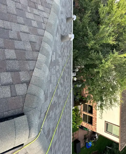 Roof slope over the garage after a two-visit repair in Pearland