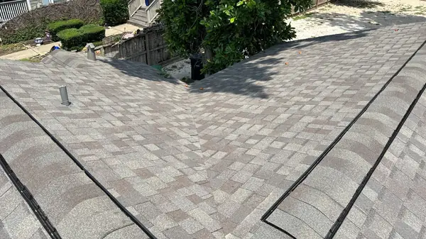 Front slope over the porch of a replaced Heights roof