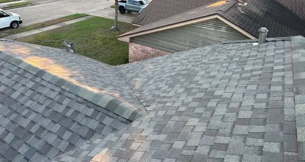 New shingles and pipe boots on a one-story Houston roof