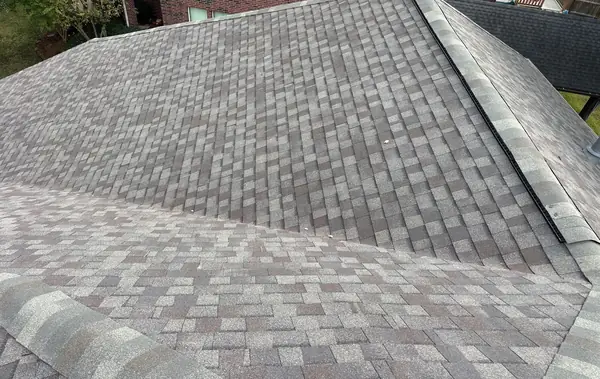 Ridge cap and intersecting slopes on a new Houston roof