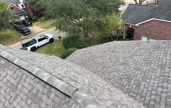 Front slope of a replaced roof looking toward the street in 77040
