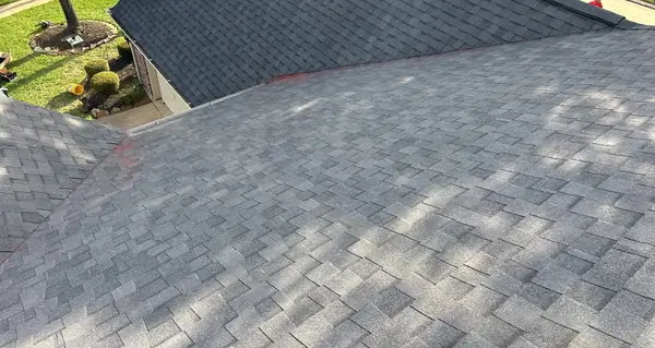 Ridge cap and slopes of a new laminate roof in Houston, TX