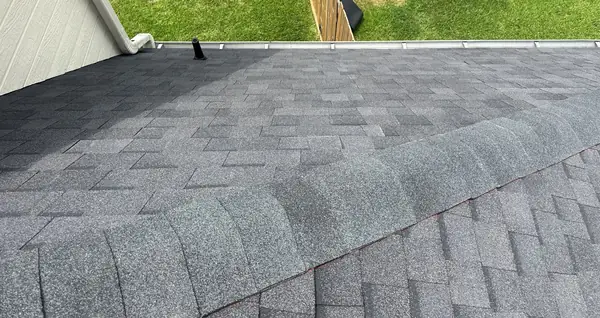 Rear ridge of a replaced roof with pipe boot on a brick home in Houston