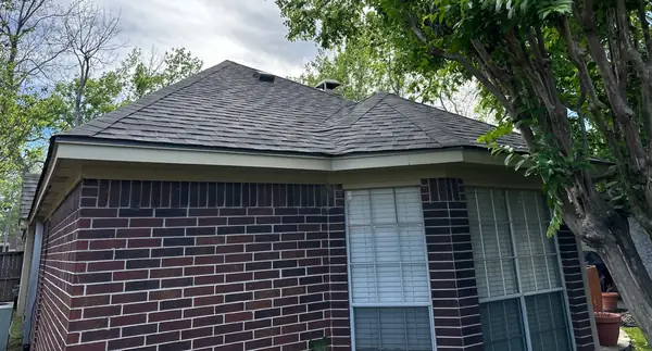 Hip ridge of a replaced roof in Sugar Land, TX