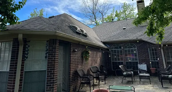 Rear elevation with a new laminate roof in Sugar Land