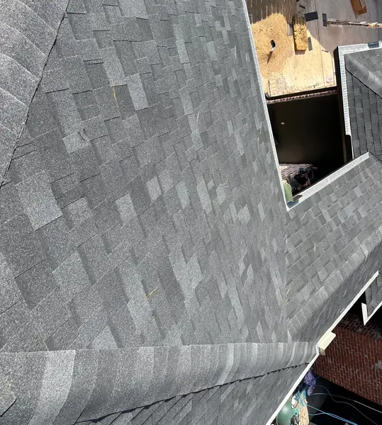 Ridge cap and slope of a new laminate roof in Houston