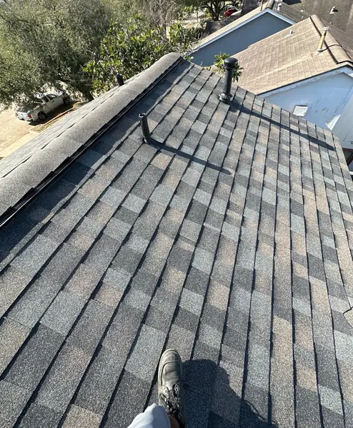 New shingles and ridge on a May 2026 roof replacement in north Houston