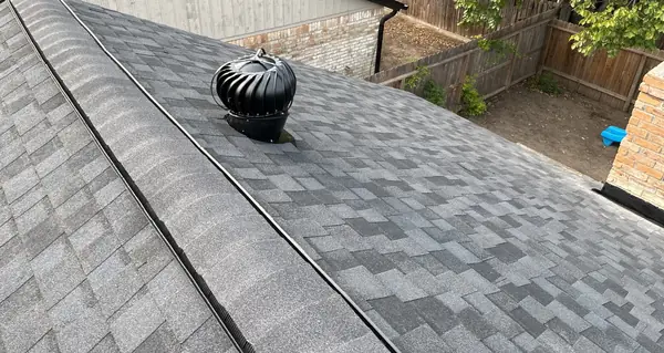 New turbine vent on the ridge of a one-story brick home in 77084