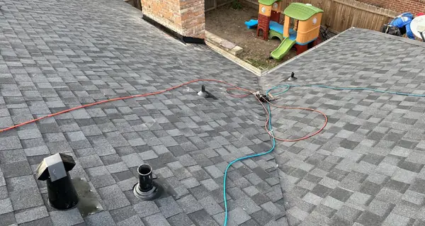 Finished roof with new vents looking down to a backyard playset