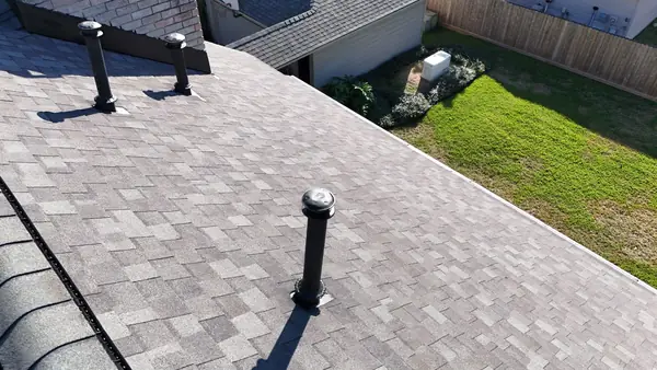 Brick chimney re-flashed on a new Kingwood, TX roof