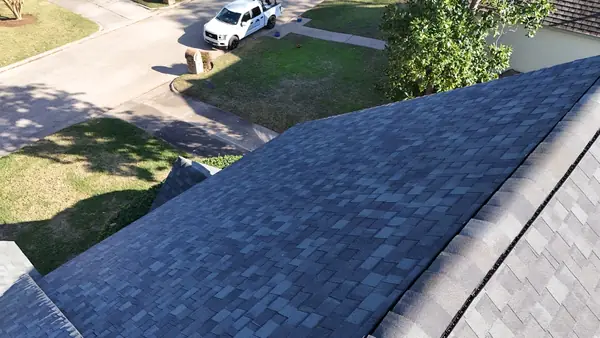 New gutter screens on a Kingwood roof edge