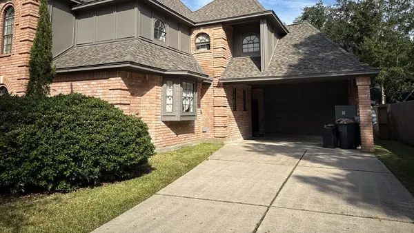 Front corner and garage with the completed roof