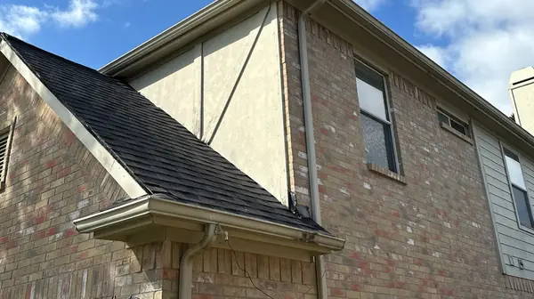 Side elevation showing the new black shingles and siding
