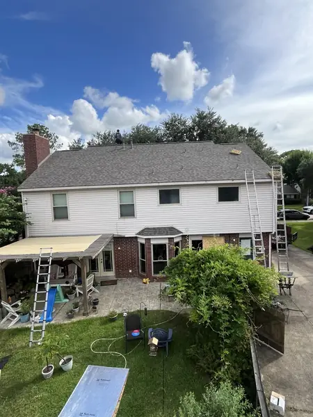 Front of a two-story Houston home with a new roof