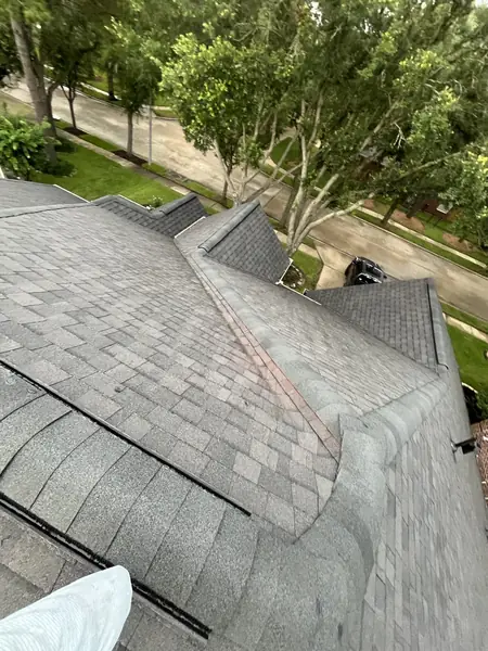 Rear slope of a new laminate shingle roof in northwest Houston