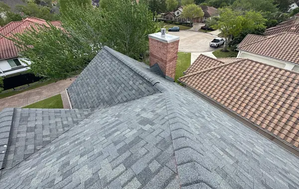 Ridge and hip intersections on the completed roof with the chimney chase