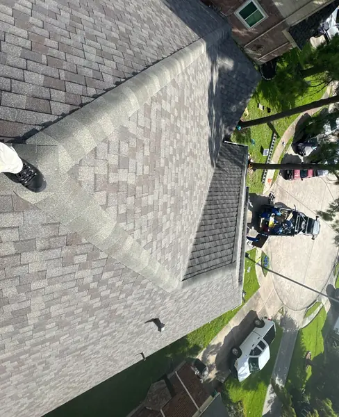 New roof edge and ridge cap on a steep Houston home