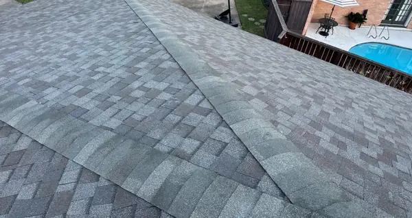 Weathered Wood shingles along the ridge of a west Houston roof replacement