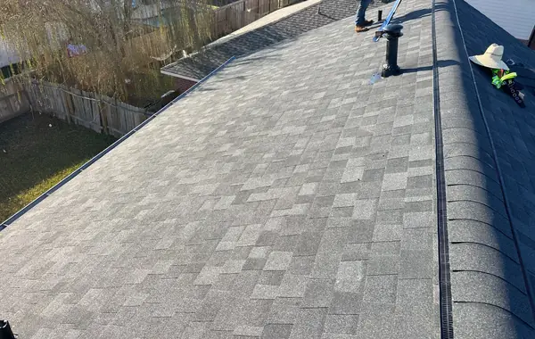 Rear hip slope of a replaced roof in Houston, TX