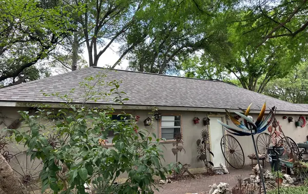 Replaced roof and painted fascia on a one-story wing of a Houston home