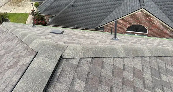 Hip lines of the new roof with neighboring homes beyond