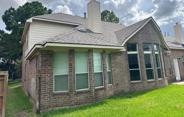 Rear elevation of a July 2026 roof replacement in Houston, TX