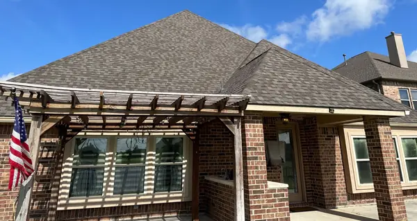 Back of the house with the pergola under the replaced roof