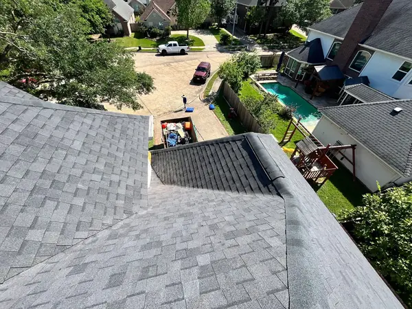 Second-story wall flashing on a new shingle roof in Houston, TX