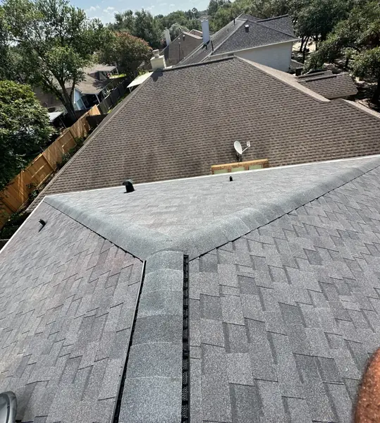 New roof slope and chimney chase flashing on a one-story Houston house