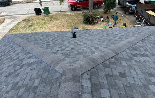 Hip ridge of a new shingle roof in Houston, TX
