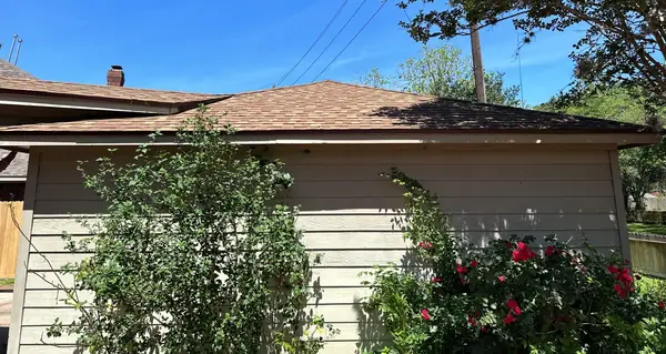 Side elevation with new gutters in Sugar Land