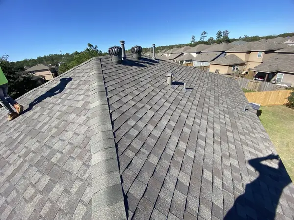 Main ridge of the completed roof looking across the neighborhood