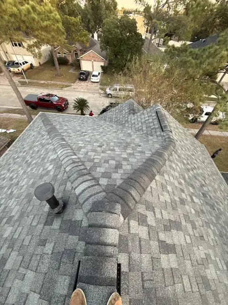 Hip and ridge lines on the steep upper roof, Cypress 77429
