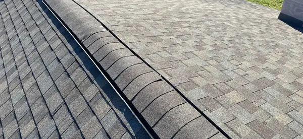 Ridge cap detail on the completed hip roof
