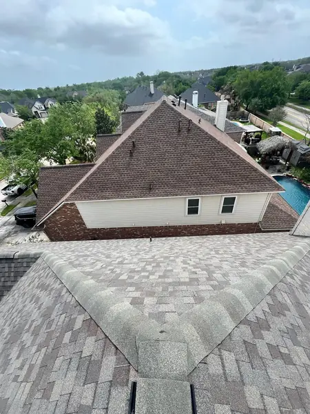 Ridge cap and valley detail on a new League City roof