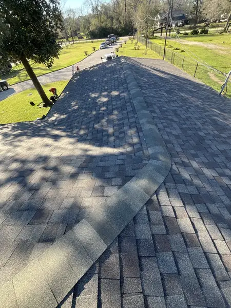 Ridge cap and valley detail on a new Houston roof
