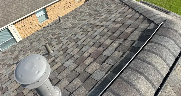 New pipe jack flashed into the Weathered Wood shingles