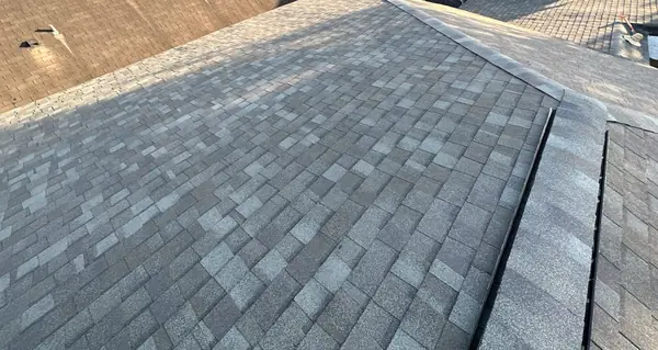 Transition between main roof and addition on a Houston home