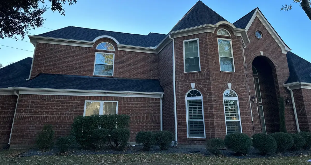 Large two-story brick Houston home in 77041 with a new charcoal laminate roof