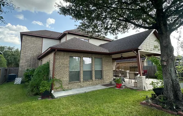 Rear patio cover and main roof after replacement