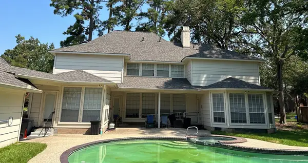 Rear of the house with the completed roof above the pool
