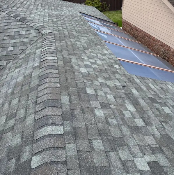 Ridge cap and skylight on a replaced roof in Houston, TX