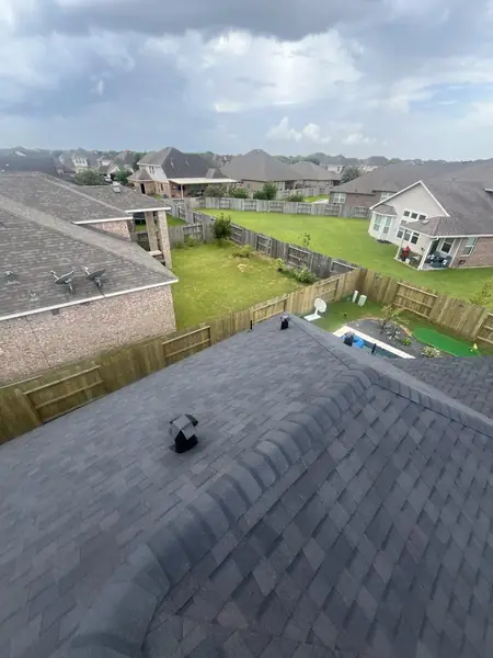Charcoal shingle roof looking down the main hip toward the backyard