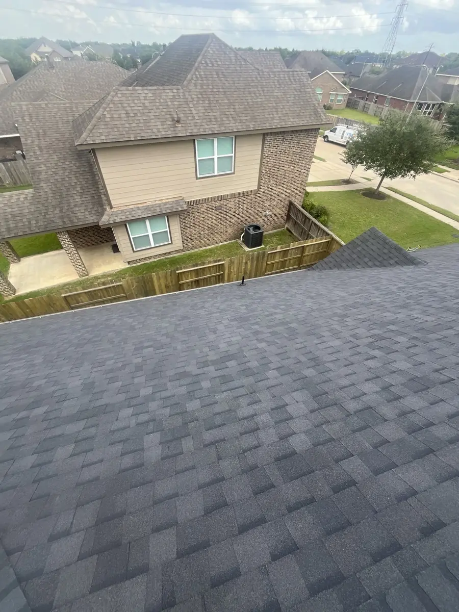 Completed roof of a two-story brick home in southeast Houston