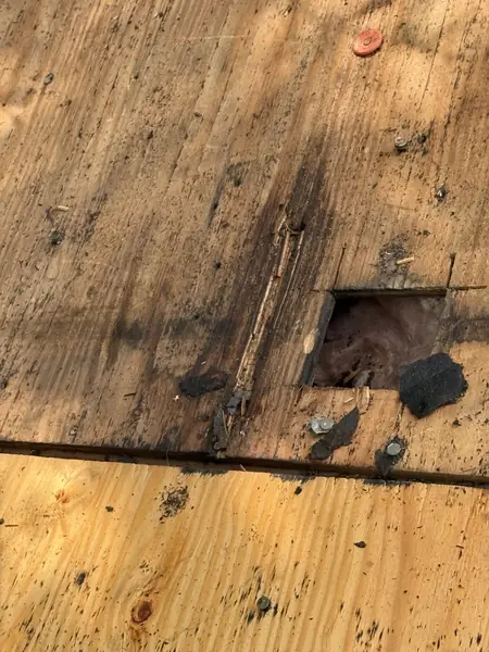 Decking rot around a roof penetration before replacement