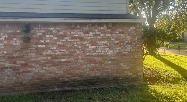 Eave and brick wall after the replacement