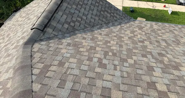 Hip and valley of a new charcoal roof in Fall Creek, Humble
